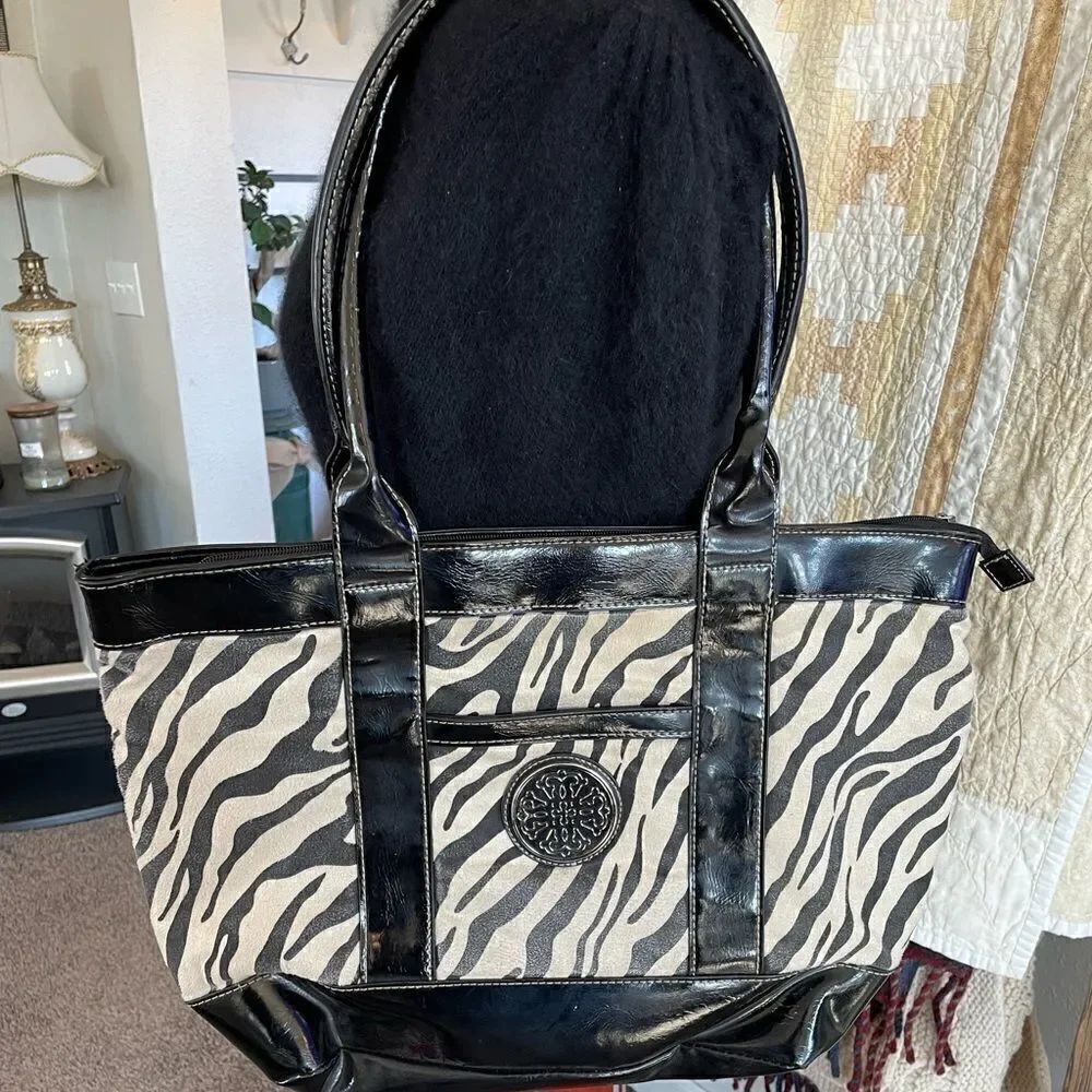 Pre-Owed Treviso Animal Print Tote with White Gold Accents